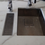 WETT Solutions kitchen bench drain, bench mounted drainage for homes and bars.